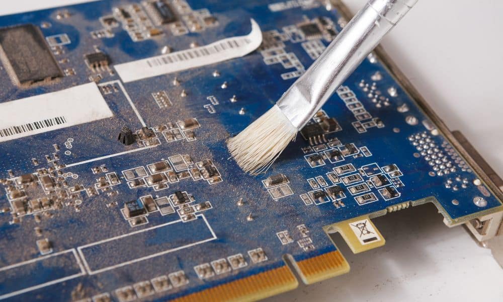 Cleaning dust from a circuit board