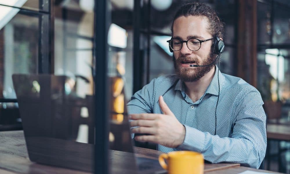 Person on video call with laptop