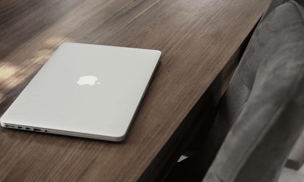 Silver laptop on wooden table