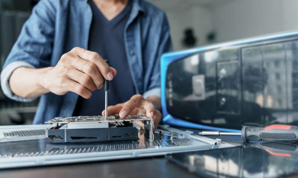 Person repairing computer hardware components